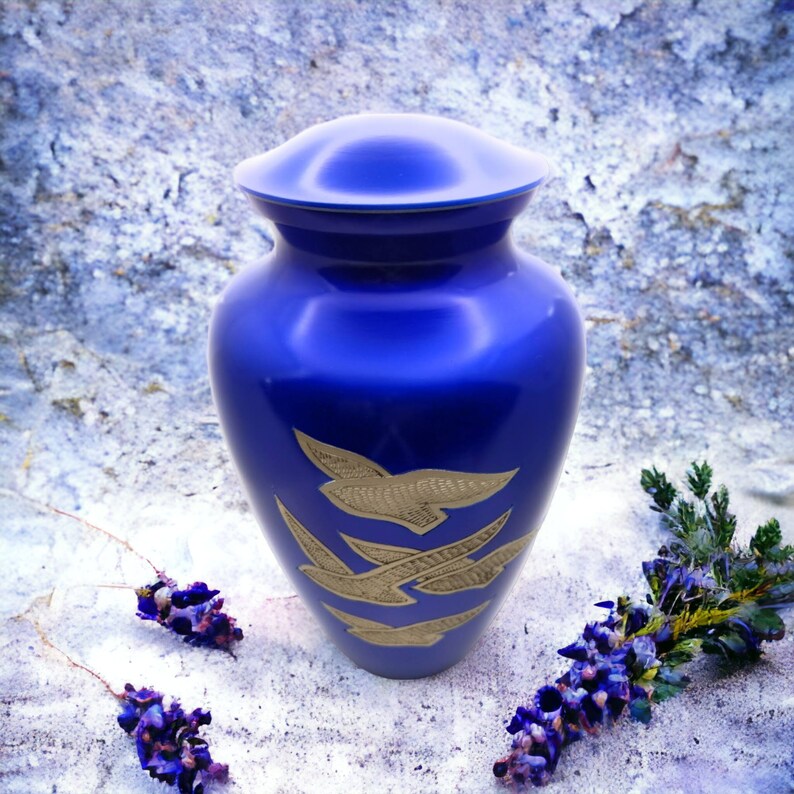 Adult Cremation Urn: Exquisitely Designed Blue Soaring Dove cremation urn brings beautiful sophistication to your loved one’s final resting place.