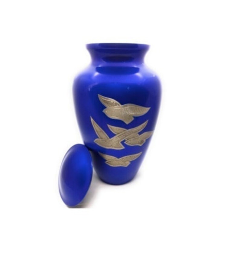 Adult Cremation Urn: Exquisitely Designed Blue Soaring Dove cremation urn brings beautiful sophistication to your loved one’s final resting place.
