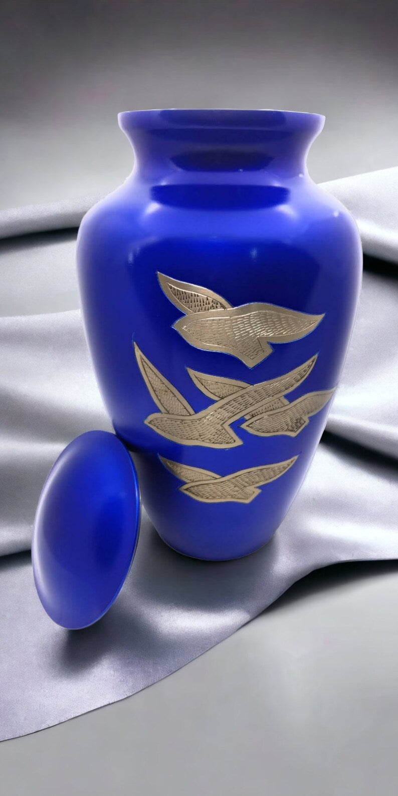 Adult Cremation Urn: Exquisitely Designed Blue Soaring Dove cremation urn brings beautiful sophistication to your loved one’s final resting place.
