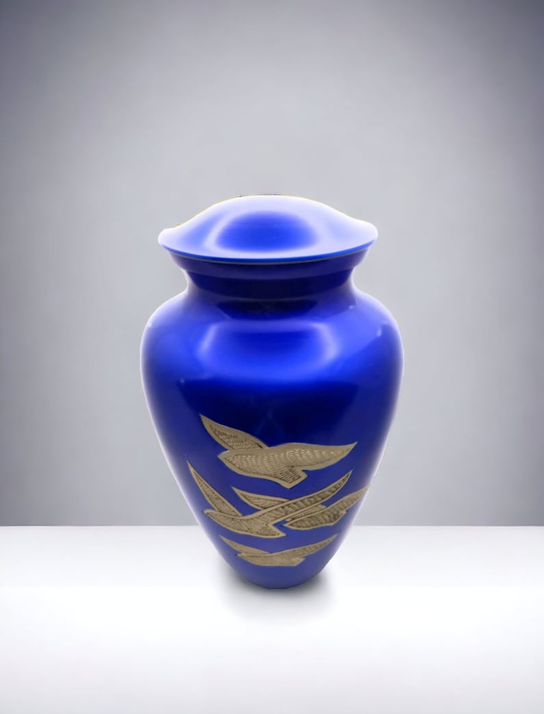 Adult Cremation Urn: Exquisitely Designed Blue Soaring Dove cremation urn brings beautiful sophistication to your loved one’s final resting place.
